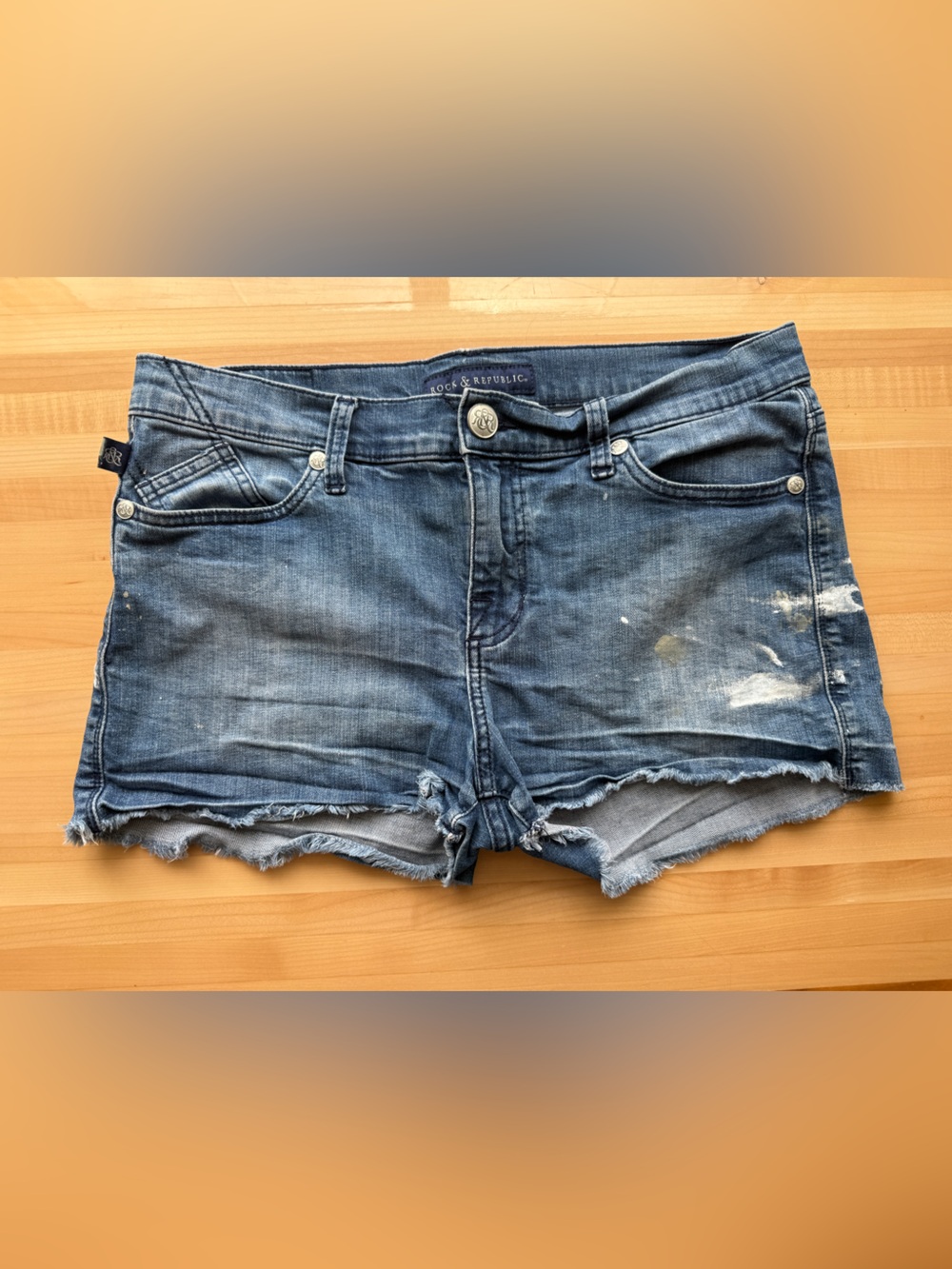 Rock & Republic Low Rise Faded Blue Paint Splatter Distressed Denim Cutoff Short